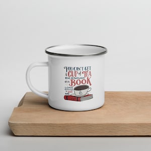 May include: White enamel mug with a silver rim featuring a quote by C.S. Lewis: "You can't get a cup of tea big enough for a book long enough to shut me."