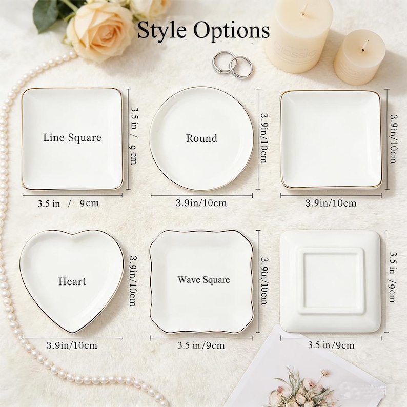 May include: A selection of white ceramic trinket dishes in various shapes: square, round, heart, and wave square. Each dish has a gold trim and is labeled with its shape. Dimensions are provided in inches and centimeters.