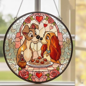 May include: Round stained glass window featuring two dogs sharing spaghetti, with a candle and hearts. The artwork is in a circular frame with a chain for hanging. The dogs are brown and tan, with a plate of spaghetti and meatballs.