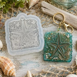 May include: A translucent silicone mold featuring a detailed starfish and seaweed design alongside a finished square keychain with a gold-tone metal ring, showcasing a teal and gold resin finish with the same embossed starfish and marine motif.