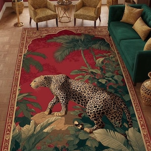 May include: A rectangular area rug with a red background and a detailed design. The rug features a leopard walking through a jungle scene with palm trees and lush greenery. The border has an ornate, patterned design.