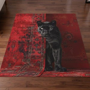May include: A red area rug with a black panther design. The rug has a traditional pattern with a distressed look. The panther is depicted in a realistic style, with its head and front legs visible.