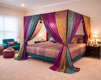 May include: A canopy bed with vibrant, patterned bedding and draped curtains in shades of purple, teal, and gold. The room features a teal armchair, matching ottoman, and a window with sheer curtains.