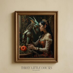 May include: Framed artwork featuring a woman in an orange and red dress embracing a teal-colored, skeletal creature. A small pumpkin sits on a table. The artwork is in a wooden frame, with the text "THREE LITTLE DUCKS - ART & DESIGN" at the bottom.