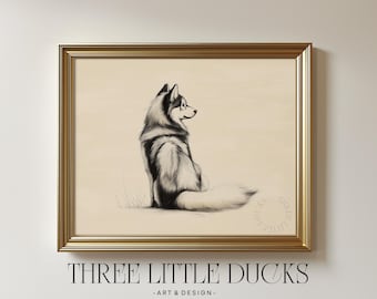 May include: A framed art print featuring a detailed pencil sketch of a husky dog in black and white. The dog is seated, facing right, with a fluffy tail. The frame is gold, and the print has the text "THREE LITTLE DUCKS - ART & DESIGN".