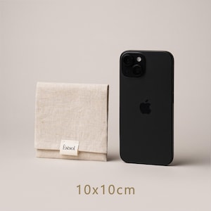 May include: A beige linen pouch with a folded flap, next to a black smartphone. The pouch has a small white label with the text "Estsol". The dimensions of the pouch are 10 x 10 cm, approximately 3.9 x 3.9 inches.