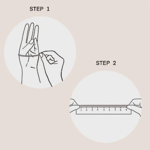 May include: A two-step instructional diagram with black line art on a light background. Step 1 shows a string wrapped around a finger. Step 2 shows the string laid flat against a ruler to measure its length in centimetres for sizing purposes.
