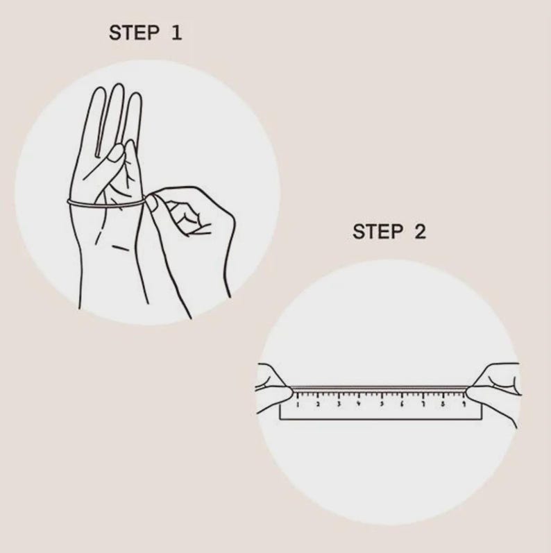May include: A two-step instructional diagram with black line art on a light background. Step 1 shows a string wrapped around a finger. Step 2 shows the string laid flat against a ruler to measure its length in centimetres for sizing purposes.
