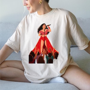 Kali Uchis Red Dress Concert Shirt,Dynamic Stage Performance Art,Fiery Kali Uchis Fan Apparel,Latin Pop Music Graphic Tee