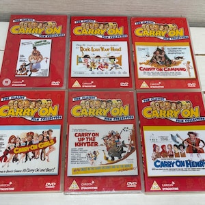 May include: A collection of six DVD cases from "The Classic Carry On Film Collection." Each red case features movie titles like "Carry On Camping" and "Carry On Girls." The cases have images from the films and the DVD logo.