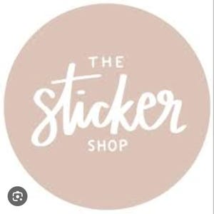 May include: A round logo with a light brown background features the white text "THE Sticker SHOP" in a handwritten style. The logo is simple and clean, suitable for branding.