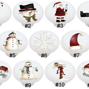 May include: Set of 11 ceramic Christmas themed cabinet knobs. The knobs feature various holiday designs including a snowman, Santa Claus, a candy cane, a snowflake, and a mailbox.