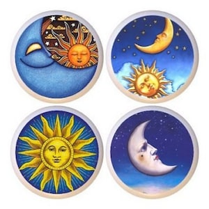 May include: Four ceramic knobs with a sun and moon design. Each knob features a different combination of the sun and moon, with one showing the sun and moon together, one showing the sun alone, one showing the moon alone, and one showing the sun and moon together with a starry background.