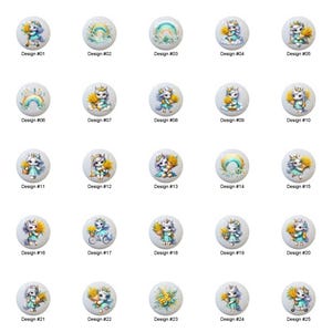 May include: A collection of 25 white round buttons, each featuring a unique design of a unicorn or rainbow. The designs include unicorns with floral accents, rainbows, and text labels like "Design #01" through "Design #25".