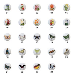 May include: Twenty-four round ceramic knobs with various floral and butterfly designs. The knobs are white with colorful images of flowers, butterflies, and insects.