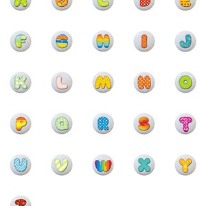 May include: A set of 26 colorful alphabet buttons with different patterns. Each button features a letter of the alphabet in a white circle with a colorful patterned background.