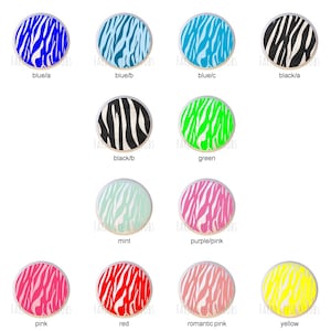 May include: Twelve round stickers with a zebra print design in various colors, including blue, black, green, mint, pink, red, yellow, and purple.
