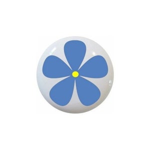 May include: Five round buttons with a flower design. The flowers are purple, yellow, blue, green, and pink. Each flower has a yellow center.