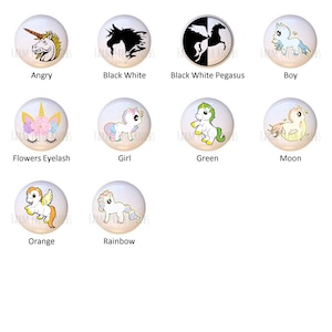 May include: Ten different designs of unicorn knobs for cabinets or drawers. The knobs are white with a variety of unicorn designs, including a black and white unicorn, a unicorn with flowers, a unicorn with rainbow colors, and a unicorn with a moon.