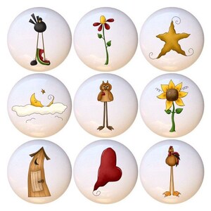 May include: Set of nine ceramic knobs featuring whimsical illustrations. The designs include a black bird, a yellow flower, a gold star, a crescent moon, an owl, a sunflower, a outhouse, a heart, and a rooster.