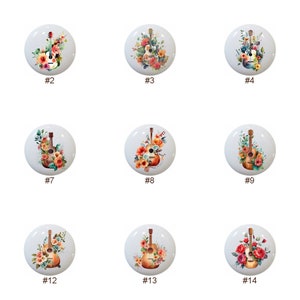 May include: A set of 14 ceramic knobs featuring a watercolor design of a guitar with floral accents. The knobs are white with a glossy finish.