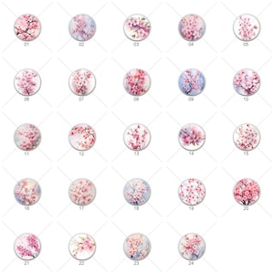 May include: Twenty-four round, white, ceramic buttons with pink and white watercolor cherry blossom designs. Each button has a number from 1 to 24 printed on it.