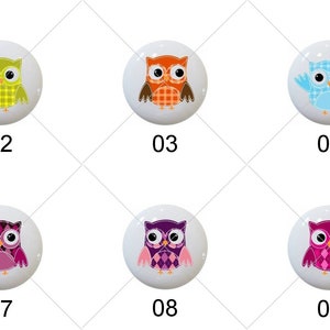 May include: Ten different ceramic owl knobs with various colorful patterns. The knobs are round and have a white background. The owls are all facing forward and have different expressions.