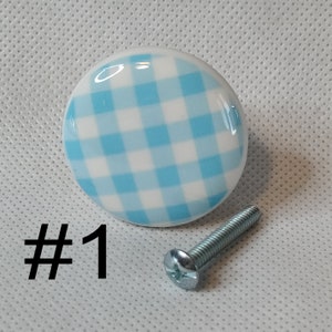 May include: A blue and white gingham ceramic knob with a silver screw.