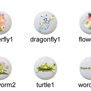 May include: Set of 10 ceramic drawer knobs featuring whimsical illustrations of a bee, butterfly, dragonfly, flowers, frog, inchworm, turtle, and word art. The knobs are white with a glossy finish.