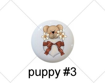 May include: Five round, white ceramic ornaments with different designs.  The first four ornaments feature a cartoon puppy in a pocket with different designs. The fifth ornament has the words "Puppy Love" with a bone graphic.
