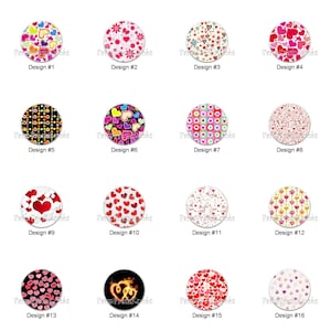 May include: A collection of sixteen round decorative knobs with various heart designs. The knobs feature a range of colors, including red, pink, yellow, and black, with patterns like polka dots and floral arrangements. Each knob is labeled with a design number.