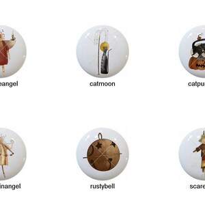 May include: Ten different ceramic knobs with various autumn-themed designs. The designs include a pumpkin, a scarecrow, a cat, a corn stalk, and an angel.