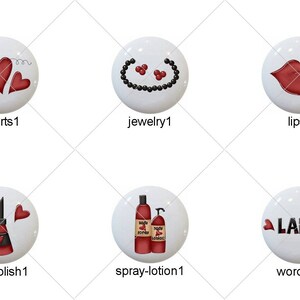May include: Set of 10 white round buttons with red and black images. The images include a hairbrush, hearts, jewelry, lips, lipstick, makeup, nail polish, spray bottle, lotion bottle, and the word "LADY".