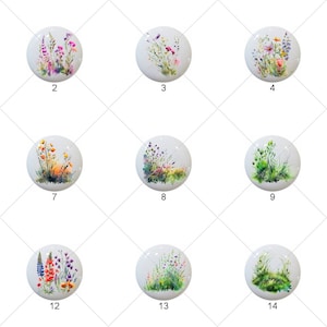 May include: Set of 14 round ceramic tiles with watercolor paintings of various wildflowers and greenery. Each tile features a different floral arrangement, including poppies, daisies, and wildflowers.