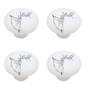 May include: Four white ceramic cabinet knobs with a black line drawing of a ballerina and the word "Ballet" in cursive.
