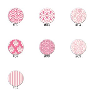 May include: A collection of twelve round decorative designs in shades of pink and white. Each design features a unique pattern, including geometric shapes, floral motifs, and stripes. Numbers #01 through #12 are printed below each design.
