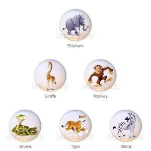 May include: Six ceramic knobs with different animal illustrations. The knobs are white with a light blue background. The animals are an elephant, giraffe, monkey, snake, tiger, and zebra.