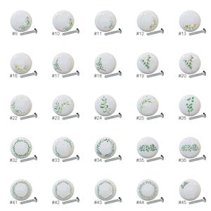 May include: Fifty ceramic drawer knobs with a white background and green floral designs. The knobs are numbered 1 through 50.