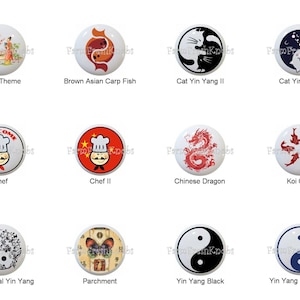 May include: A collection of decorative ceramic knobs with various designs. The knobs feature themes such as Asian scenes, carp fish, cat Yin Yang, chef, Chinese dragon, koi carp, ornamental Yin Yang, parchment, and Yin Yang symbols. Each knob has a unique design.