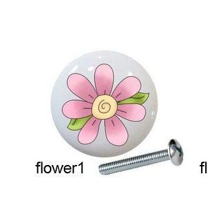 May include: Five ceramic drawer knobs with different designs. The knobs feature an angel with pink wings, an angel with blue wings, a pink flower, a flower with hearts, and a white sheep. Each knob comes with a silver screw.
