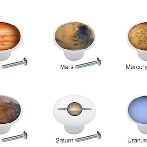 May include: Set of 10 round cabinet knobs featuring images of planets and the moon. The knobs are white with a silver screw. The planets are depicted in realistic colors and detail. The knobs are labeled with the names of the planets: Earth, Jupiter, Mars, Mercury, Moon, Neptune, Pluto, Saturn, Uranus, and Venus.
