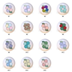 May include: Fifteen different designs of ceramic knobs with a patchwork flower design. Each knob is white with a different color scheme and pattern.