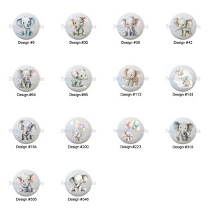 May include: A collection of decorative cabinet knobs with elephant designs. Each knob features a different elephant illustration, some with balloons. The knobs are on a light gray background, with design numbers visible.