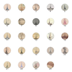 May include: Twenty-four round, white, ceramic knobs with a vintage Parisian theme. Each knob features a different design with the Eiffel Tower, handwritten text, and a map of Paris.