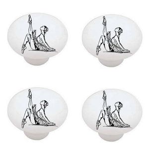 May include: Set of four white ceramic cabinet knobs with a black line drawing of a ballerina in a tutu.