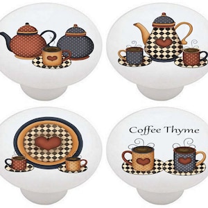 May include: Set of four ceramic cabinet knobs featuring a coffee theme. The knobs are white with a black and white checkered pattern and a red heart. The knobs feature images of teapots, coffee cups, and the text "Coffee Thyme".