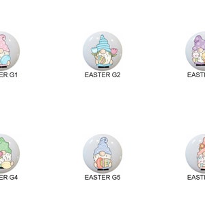 May include: Six round ceramic ornaments featuring a gnome holding Easter eggs and flowers. The gnomes are wearing pink, blue, and purple hats. The ornaments are labeled "EASTER G1", "EASTER G2", "EASTER G3", "EASTER G4", "EASTER G5", and "EASTER G6".