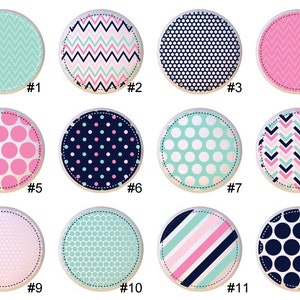 May include: Twelve different patterned circles in pink, blue, and green. Each circle has a number from 1 to 12.