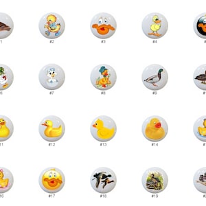 May include: Twenty ceramic knobs with various duck designs. The knobs are white with colorful images of ducks, ducklings, and rubber ducks. The knobs are numbered 1 through 20.