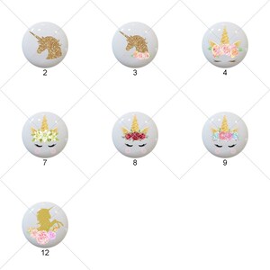 May include: Twelve different designs of unicorn buttons with gold glitter and floral accents. The buttons are round and white with a light blue background.